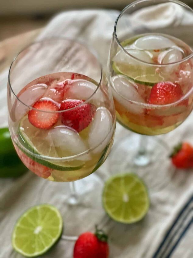 3 white wine spritzer recipes you should try, close up of white wine spritzer recipe with strawberry and limes