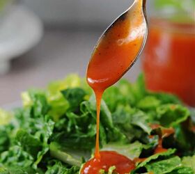 homemade sweet catalina dressing, spoonful of sweet catalina dressing pouring onto a lettuce salad