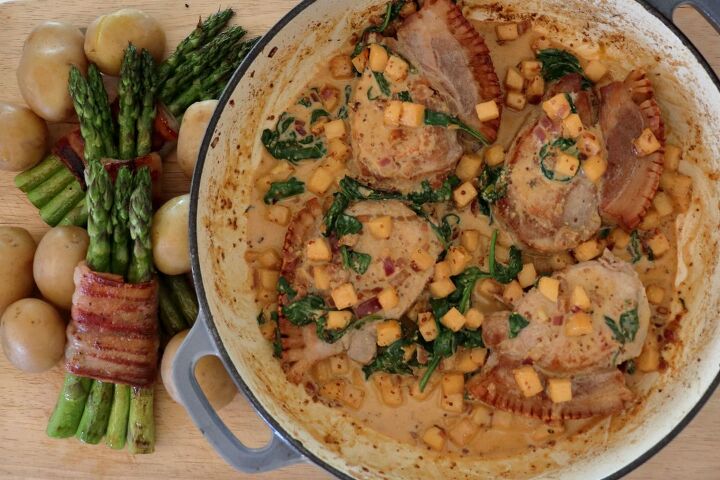 Pork chops and creamy sauce in a pan