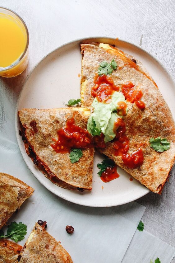 easy breakfast quesadillas, breakfast quesadillas topped with salsa and avocado creama