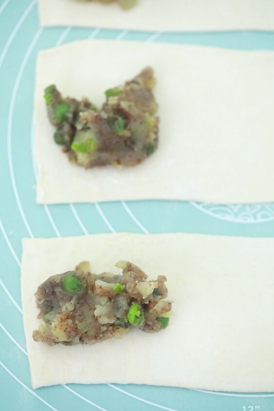 easy air fryer vegan samosas using spring roll wrappers, adding stuffing to vegan spring roll wrappers for easy air fryer samosas