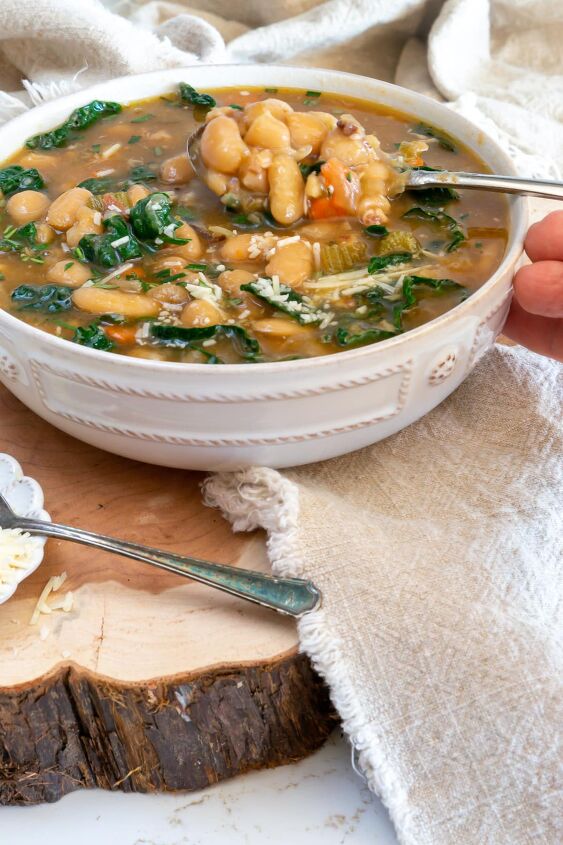 tuscan white bean soup, Tuscan White Bean Soup in a whie bowl with a spoon