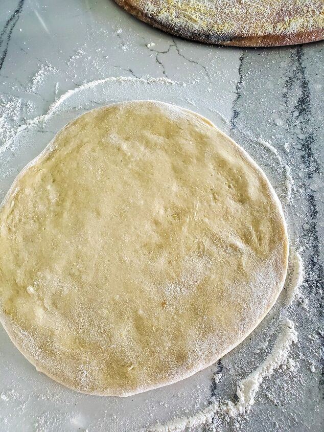 chicago tavern style pizza, Pizza dough rolled out on a floured counter