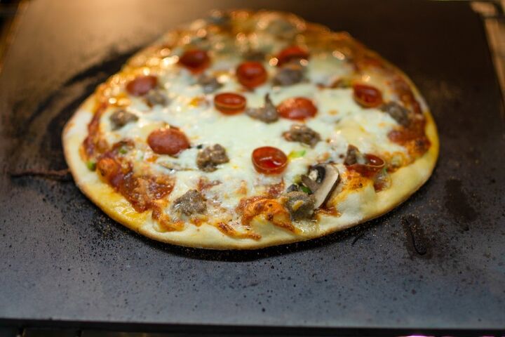 chicago tavern style pizza, Chicago thin crust pizza cooking on a Cooking Steel