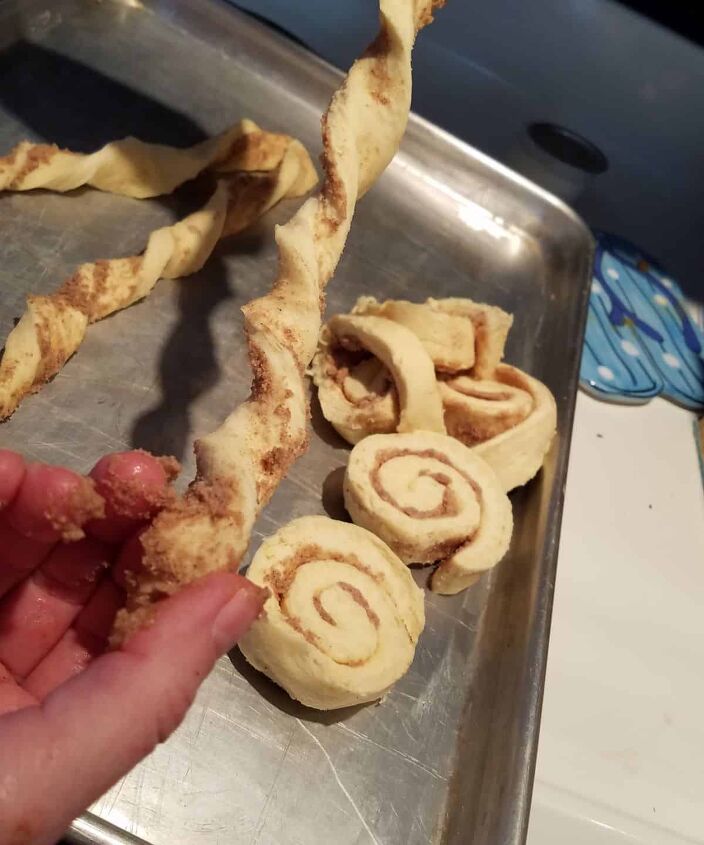 heart shaped cinnamon roll, twisting a cinnamon roll strip
