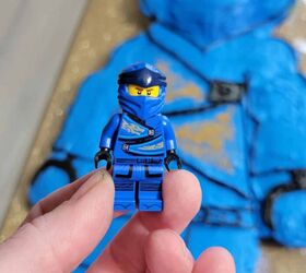 how to make a ninjago lego cake, blue minifig with cake in background