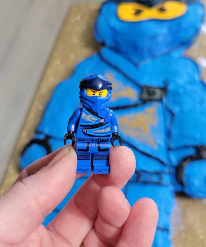 how to make a ninjago lego cake, blue minifig with cake in background