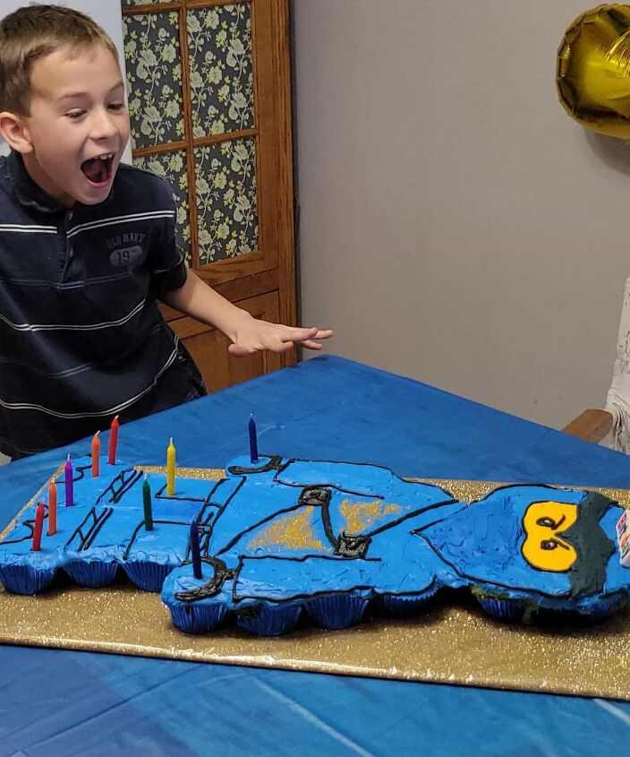 how to make a ninjago lego cake, boy sees Lego Man Cake