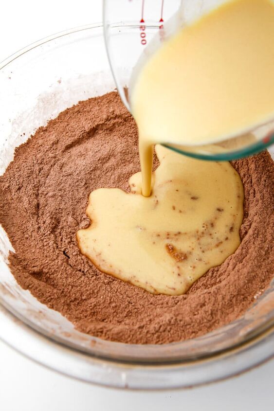 the best vegan brownies, Wet ingredients being poured into dry ingredients to make brownies