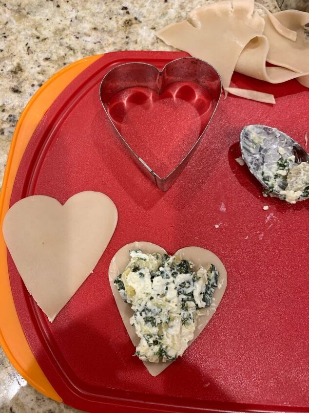 a savory valentine s day appetizer or a quick super bowl party appetiz, Valentine s Day Appetizer Here is a photo of the heart shaped cookie cutter as well as a cut out heart of dough and a last dough heart with a bit of spinach cheese mixture n top of it