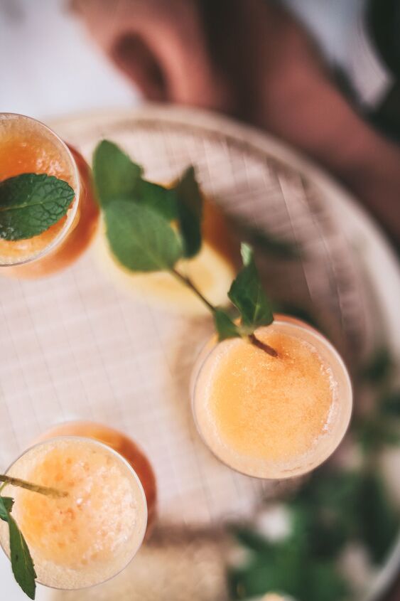 bellinis, A bellini garnished with mint on top of a trivet