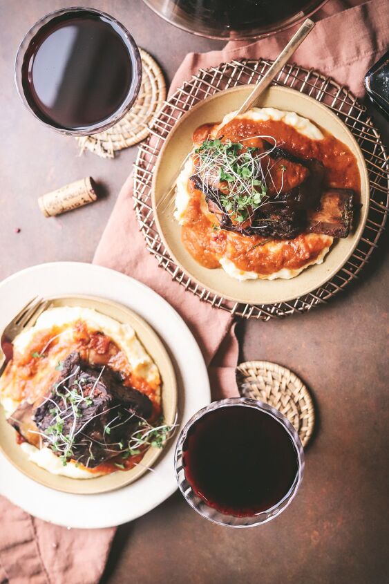braised beef short ribs, Two plates of short ribs with microgreens