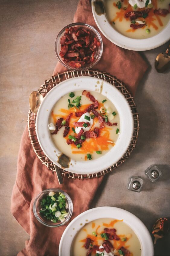 easy potato soup recipe, Three potato soups in stoneware bowls with napkin green onions and bacon