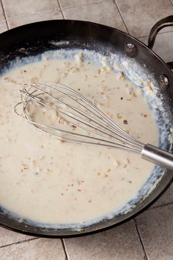 ham and cheesy potato casserole, Whisk the milk in slowly