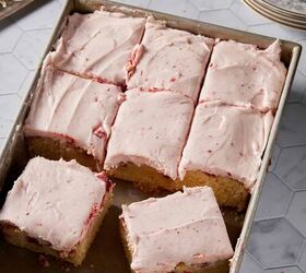 strawberry jam cake with cream cheese frosting, A cake pan with strawberry cake cut into slices