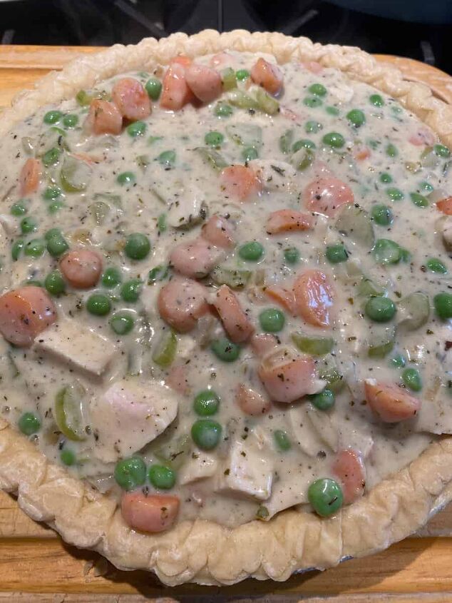 classic homemade chicken pot pie, the pie crust with pot pie filling ready to be baked