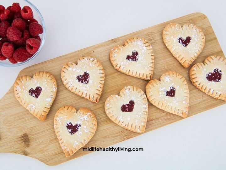 easy raspberry hand pie recipe, an overhead view of the raspberry hand pies on a cutting board