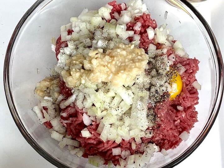 polpettone cheese stuffed meatballs, Ground beef onions eggs garlic salt pepper in a bowl before being mixed
