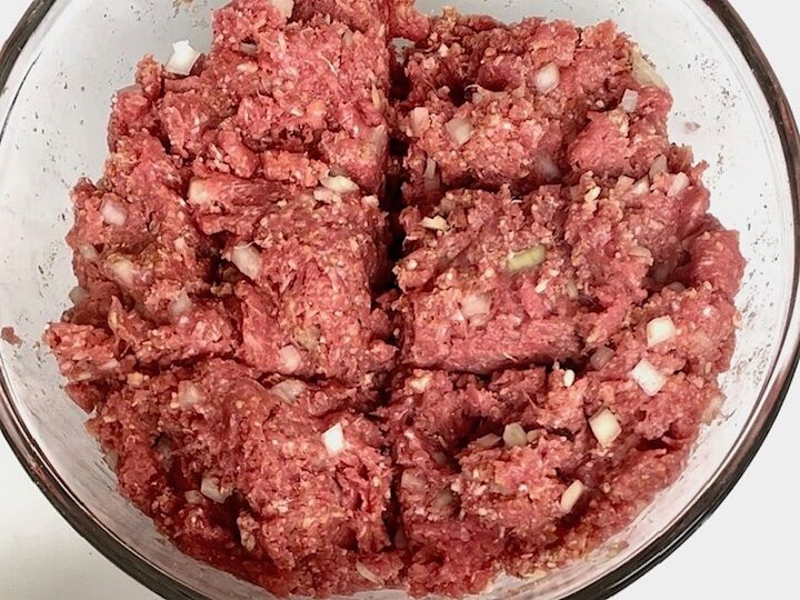 polpettone cheese stuffed meatballs, Ground beef mixed with ingredients and divided into 6 sections in q bowl for Polpettone recipe