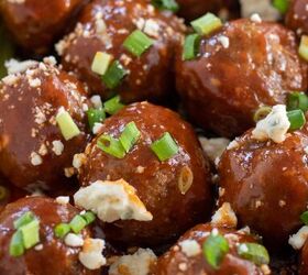 crockpot buffalo bbq chicken meatballs, A close up shot of chicken meatballs with buffalo bbq sauce smothered on them They re topped with blue cheese and chopped green onions