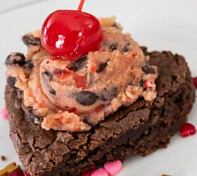 Heart shaped fudgy brownie topped with Cherry Chocolate Chip Cookie Dough Frosting