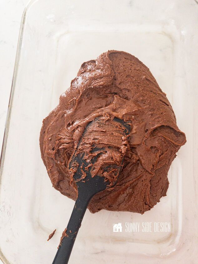 Spread fudgy brownie batter into a greased baking pan