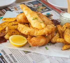 crispy beer battered fish and chips, Homemade fish and chips served on newspaper