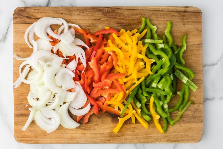 how to saute onions and peppers, Sliced red yellow and green bell peppers and onions