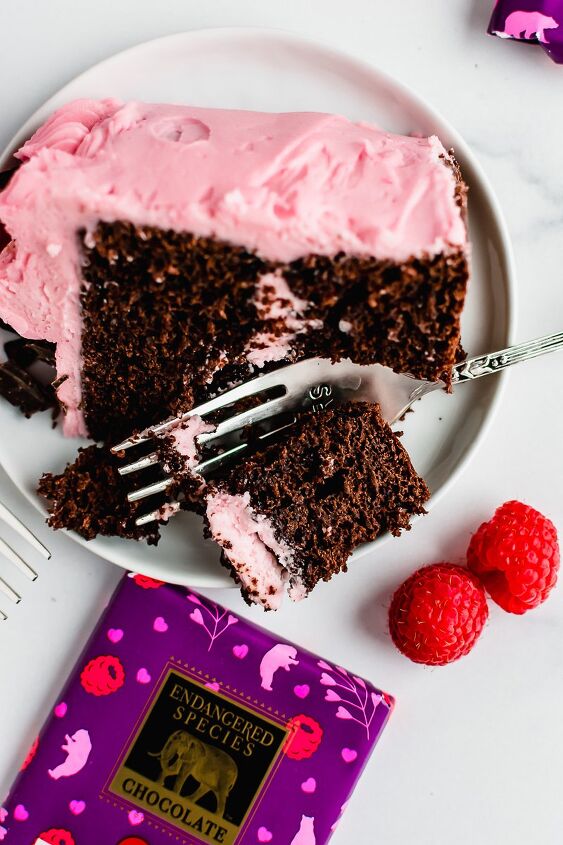raspberry chocolate layer cake for two, Slice of raspberry chocolate layer cake on a white plate with a fork