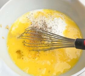 easy cheesy sausage egg bake, eggs mixture in white bowl
