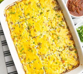 easy cheesy sausage egg bake, sausage egg bake in a white caserole dish