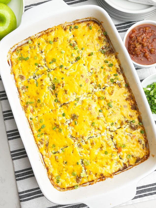 easy cheesy sausage egg bake, sausage egg bake in a white caserole dish