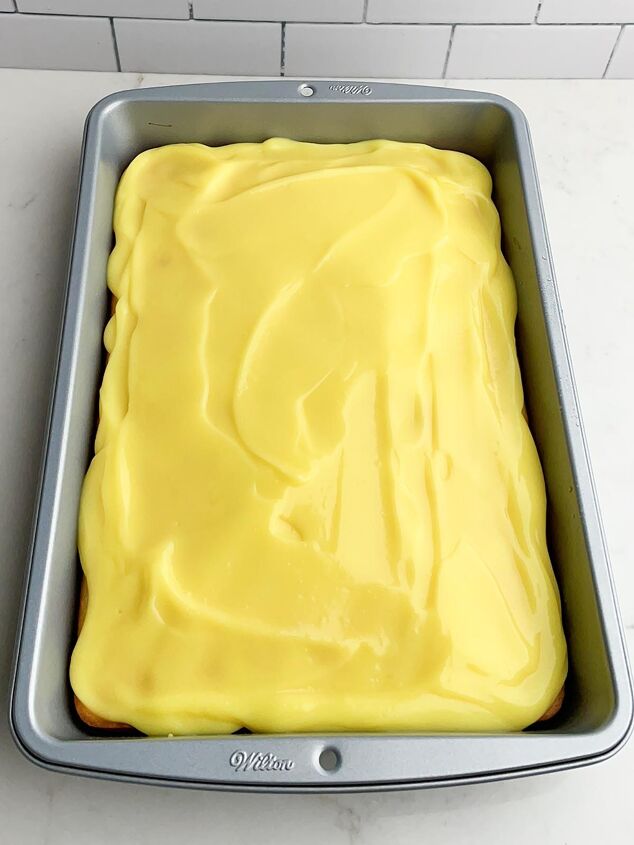 lemon poke cake, white cake withe lemon pudding spread on top
