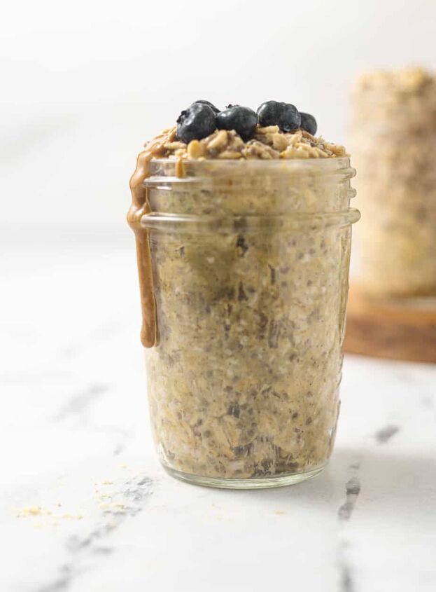 quick simple protein overnight oats, Protien overnight oats in a mason jar with peanut butter and blueberries on top