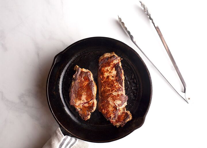 steak au poivre, Steaks seared in cast iron skillet