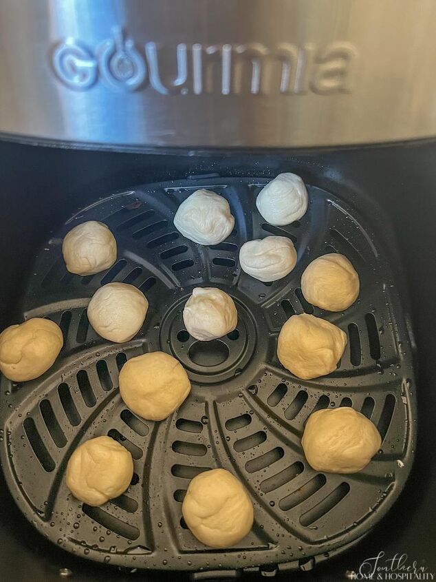 new orleans biscuit beignet recipe it s big easy air fryer fast, Uncooked biscuit pieces in air fryer basket