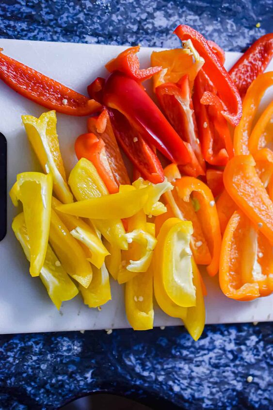 one pot sausage and peppers, The peppers are sliced on a cutting board