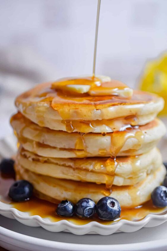 fluffy pancakes with cake flour, Maple syrup is being poured onto the pancakes