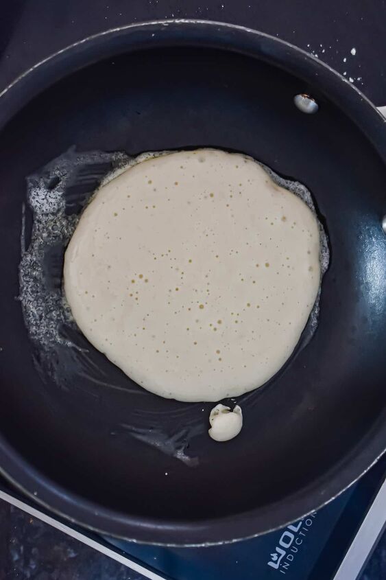 fluffy pancakes with cake flour, A scoop of the pancakes with cake flour batter is in a pan