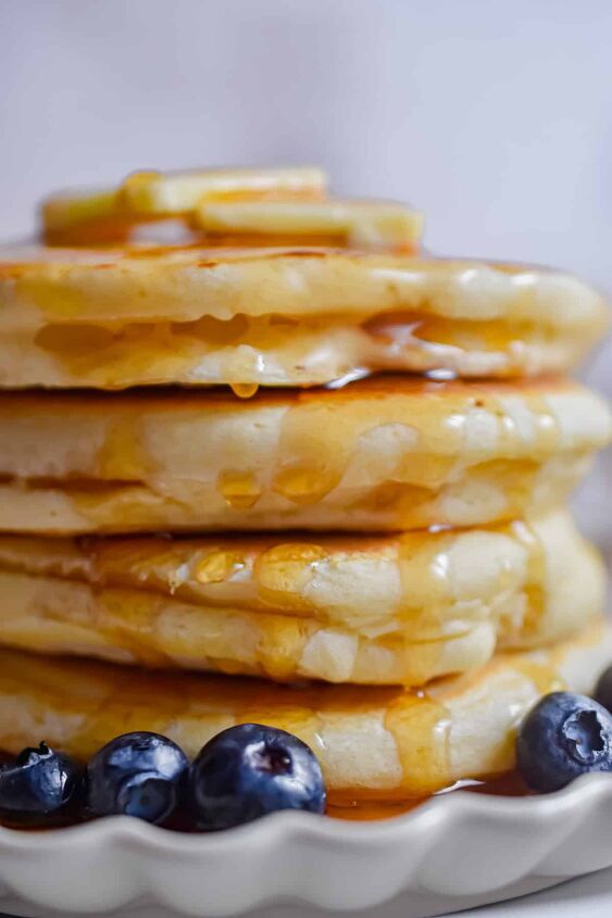 fluffy pancakes with cake flour, A close up of the stack of pancakes with cake flour and maple syrup dripping down