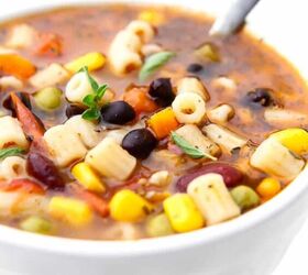 vegan minestrone soup, A white bowl filled with vegetarian minestrone soup with a spoon in it