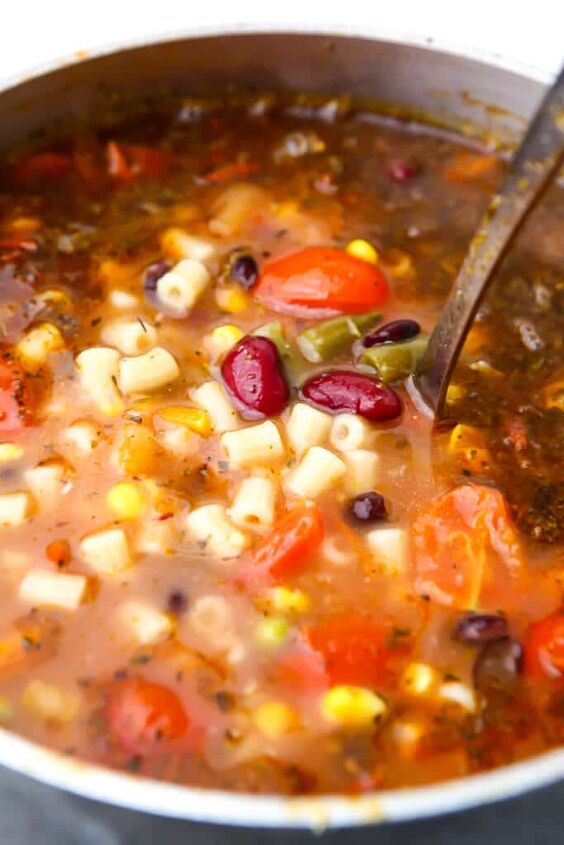 vegan minestrone soup, A soup pot full of minestrone with a ladle in it
