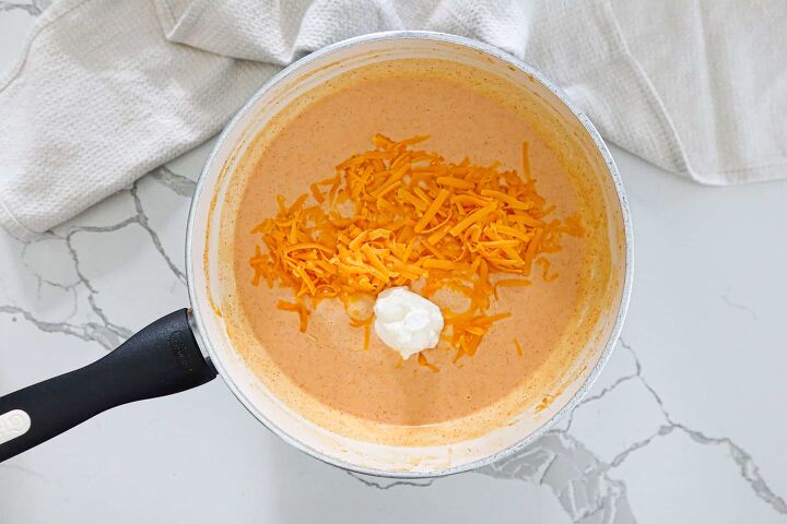 healthy queso dip low carb keto gluten free, Shredded cheese and sour cream added to sauce mixture
