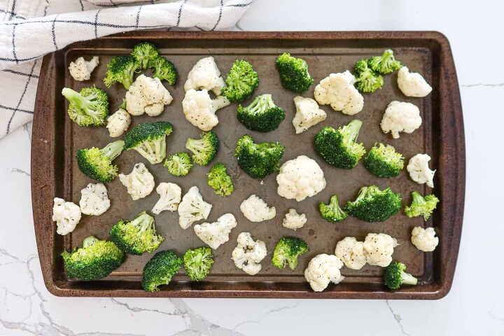 roasted broccoli and cauliflower recipe the easiest side, Seasoned florets arranged on a large baking sheet