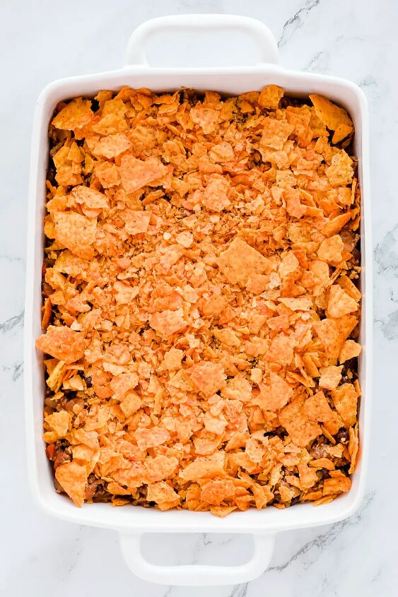 walking taco casserole with doritos, Crushed nacho chips on top of casserole