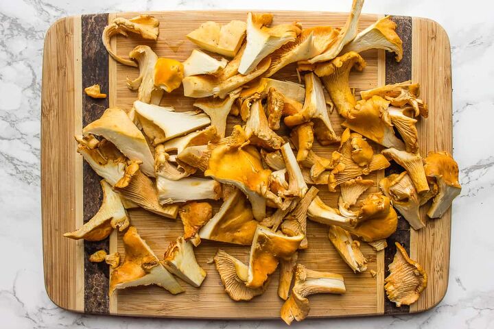 the complete guide to vegan mushroom stroganoff, Chopped chanterelle mushrooms on a cutting board