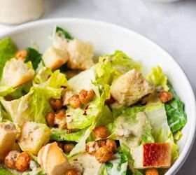 crowd pleasing vegan caesar salad you won t believe it s dairy free, Vegan Caesar Salad with crispy chickpeas and croutons in a white bowl on a white table