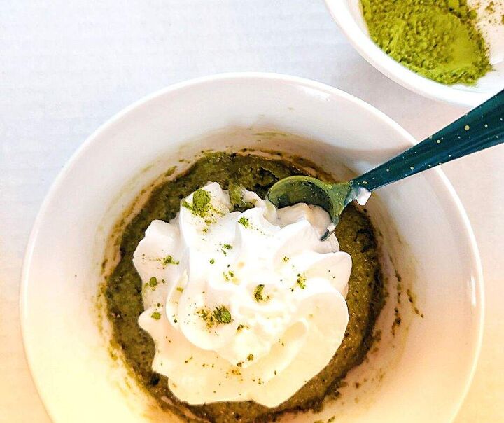 2 minute easy matcha mug cake that matcha latte lovers need in their l, Matcha mug cake with whipped cream and a spoon