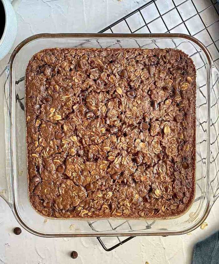 chocolate baked oatmeal happy honey kitchen, Finished baked oatmeal with chocolate chips on top is in a square glass baking dish