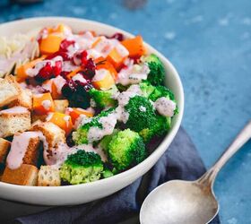 roasted cranberry broccoli salad, Cranberry broccoli salad in a white bowl next to a spoon